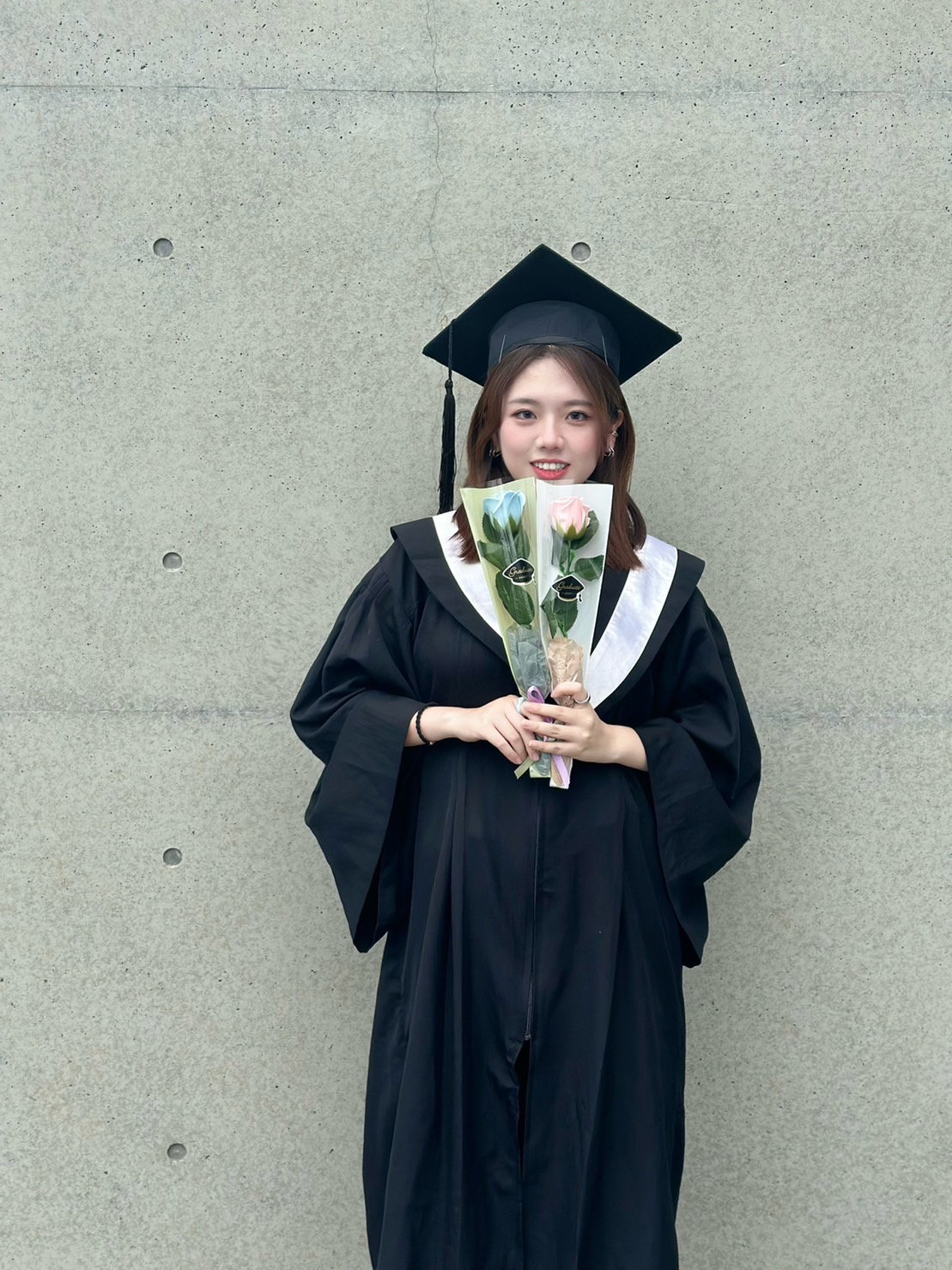 The photo features Cai-Li Weng, a graduate from the Department of Audiology and Speech-Language Pathology at Asia University, who successfully passed this year's national examination for audiologists and secured the impressive second position