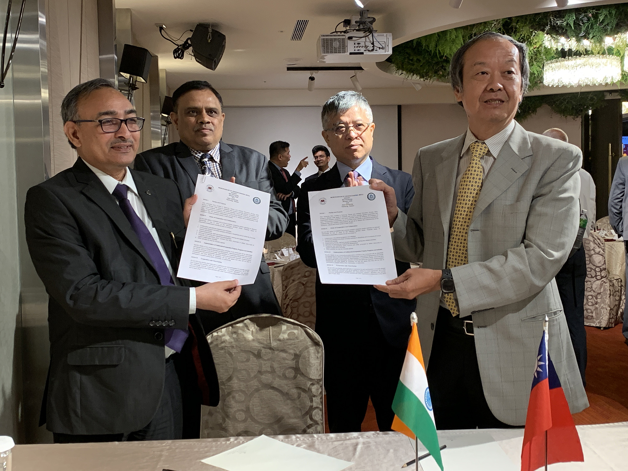 President of IES University, Bhopal, India (left), Er. B.S. Yadav, signs the MOU with the Vice President of Asia University and Dean of the College of Information and Electrical Engineering, Shian-Shyong Tseng (front right). The signing is witnessed by Deputy of the Ministry of Education, Mon-Chi Lio (back right) and Professor Tarak of the All India Council for Technical Education (back left)
