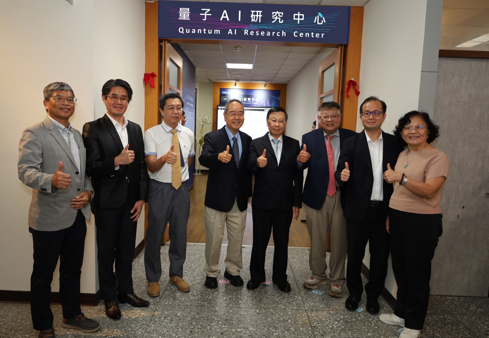 At the inauguration of the Quantum AI Research Center: Asia University President Jeffrey J.P. Tsai (fourth from right), Honorary Director Prof. Kang-Lung Wang (fifth from right), Center Director Prof. Kuan-Tsae Huang (third from right), and Phison Electronics spokesperson Kuo-Ting Lu, among others